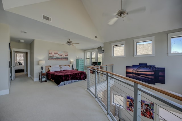 bedroom featuring visible vents, multiple windows, high vaulted ceiling, and carpet flooring