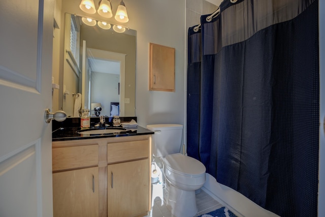 full bath featuring tile patterned floors, a shower with curtain, toilet, and vanity