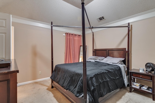 carpeted bedroom with visible vents, a textured ceiling, and baseboards