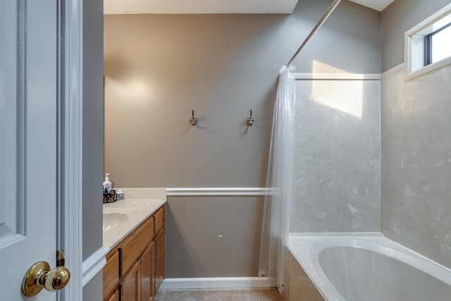 full bathroom with curtained shower, vanity, and a tub to relax in