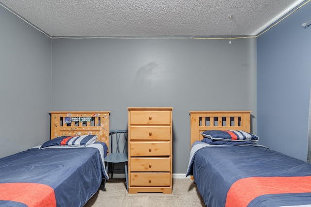 bedroom with a textured ceiling and carpet flooring