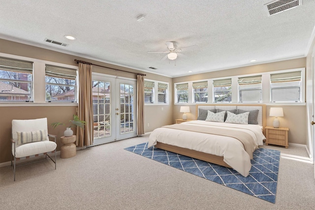 carpeted bedroom featuring access to exterior, french doors, visible vents, and baseboards