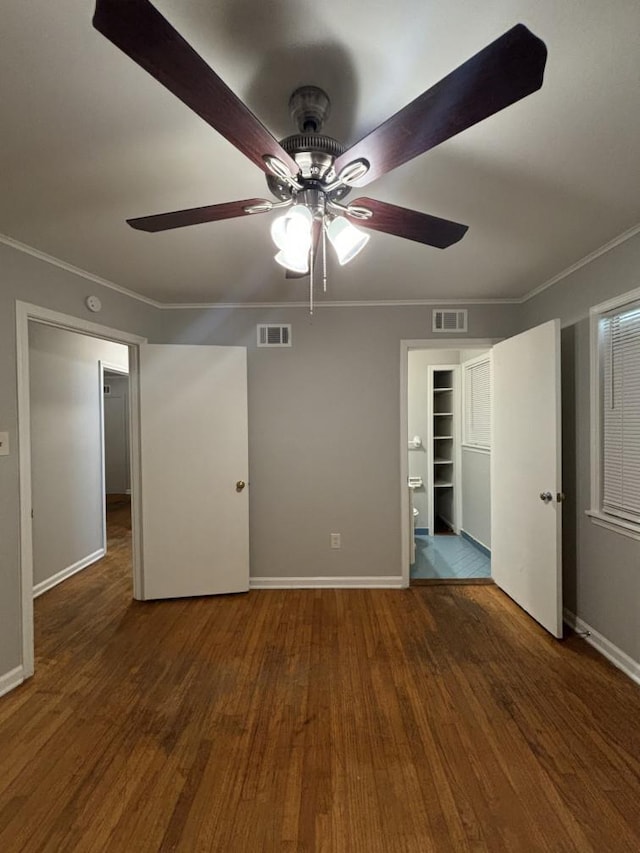 unfurnished bedroom featuring crown molding and visible vents