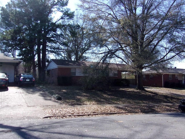 view of property exterior with driveway