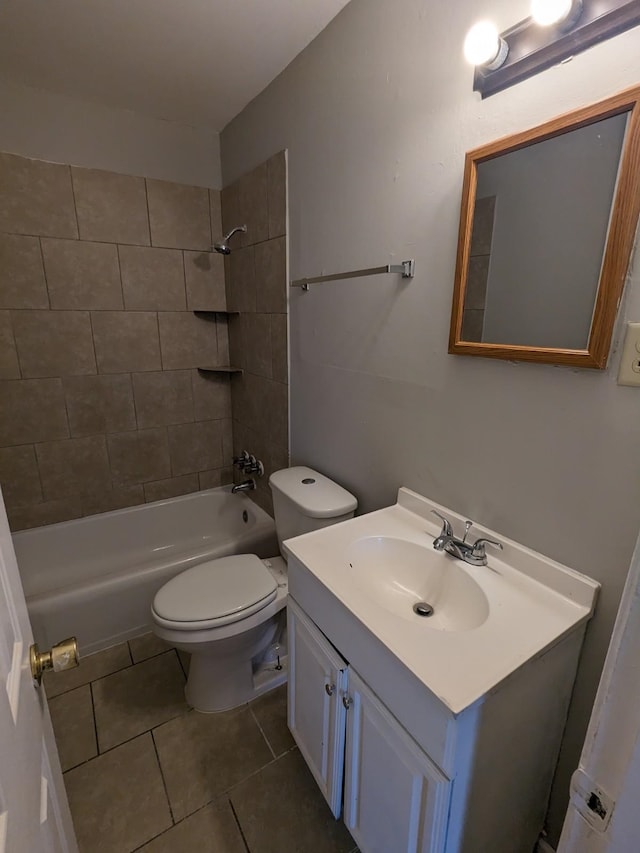 bathroom featuring shower / bathtub combination, toilet, vanity, and tile patterned flooring