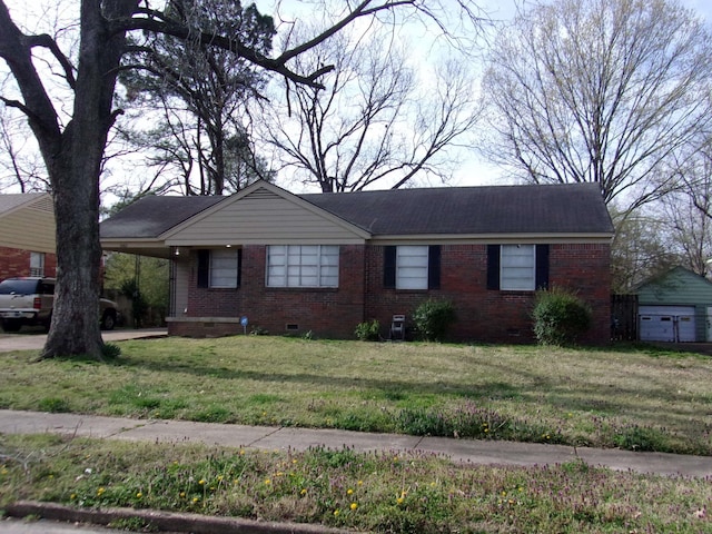 ranch-style home with a front yard, a carport, brick siding, and crawl space