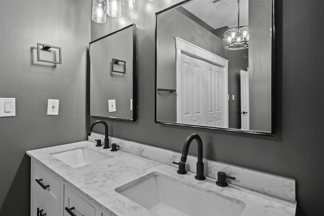 bathroom featuring double vanity and a sink