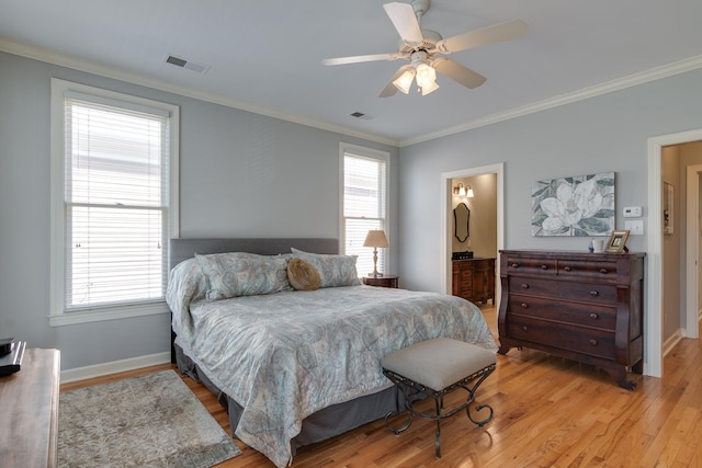 bedroom with visible vents, multiple windows, and light wood-style floors