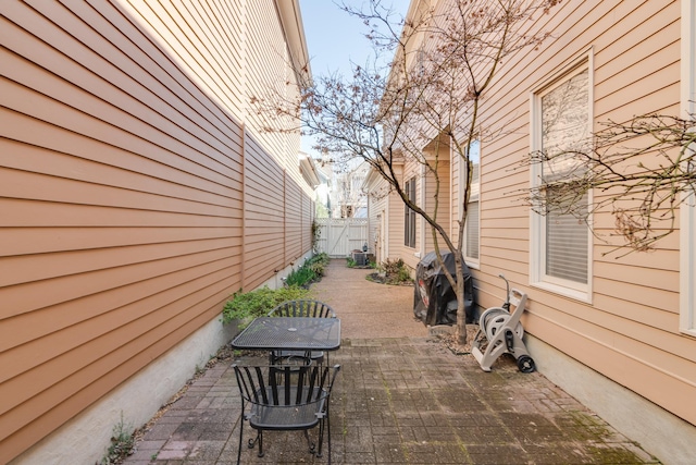 view of patio / terrace featuring fence