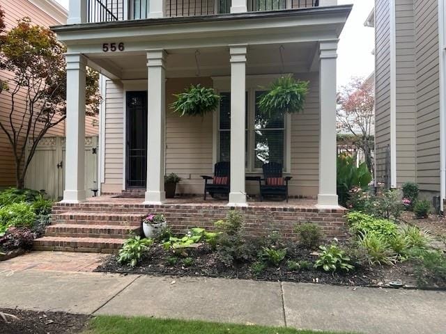 property entrance featuring covered porch