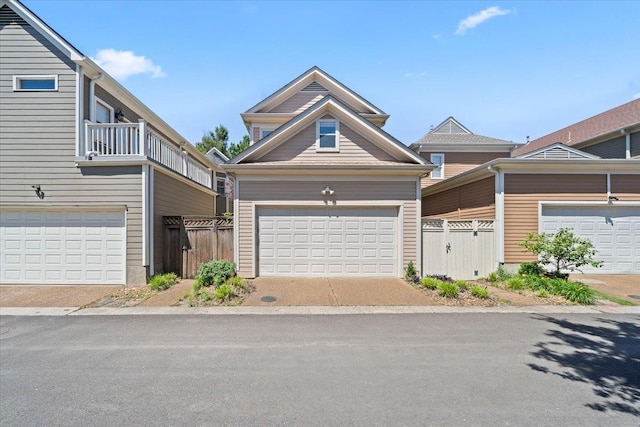 556 Monteigne Blvd, Memphis, TN 38103 - townhome / multi-family property featuring fence, a garage, and a balcony