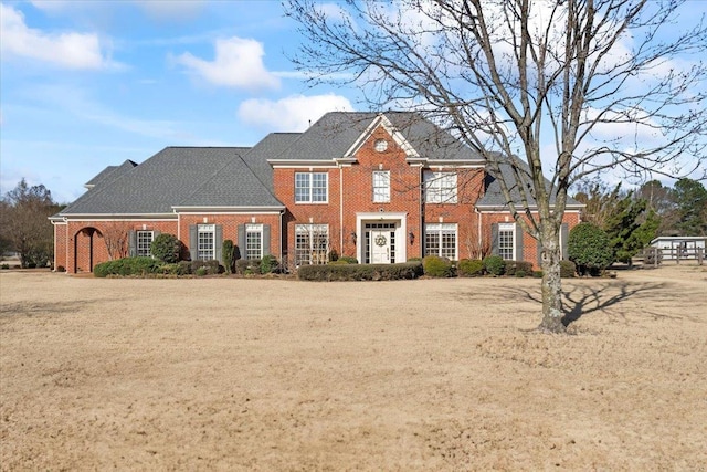 view of front of property featuring brick siding