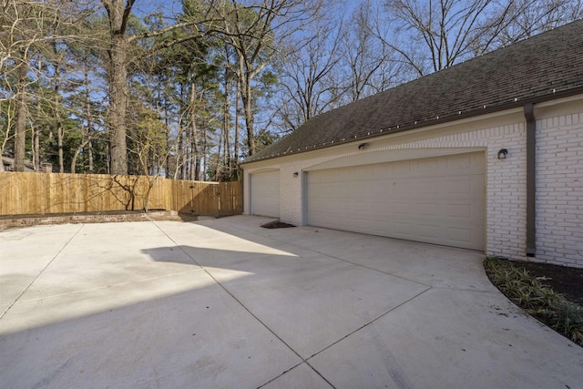 garage with fence