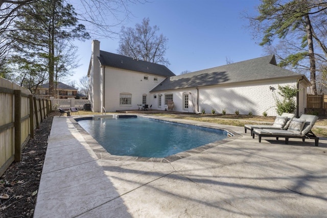 view of swimming pool featuring a patio, a fenced backyard, and a fenced in pool