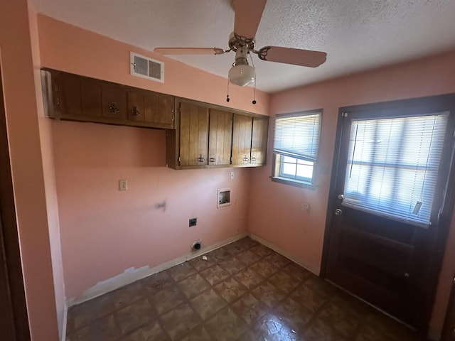 washroom featuring hookup for a washing machine, visible vents, hookup for an electric dryer, cabinet space, and dark floors