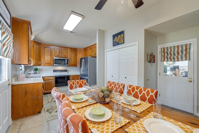 dining room featuring visible vents, ceiling fan, and vaulted ceiling