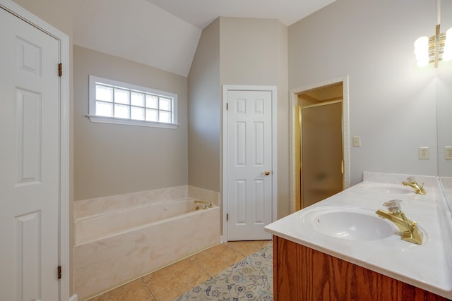 full bath featuring tile patterned flooring, a garden tub, a shower stall, and a sink