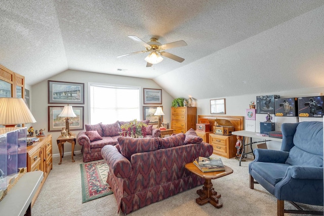 living room with visible vents, ceiling fan, vaulted ceiling, a textured ceiling, and light colored carpet