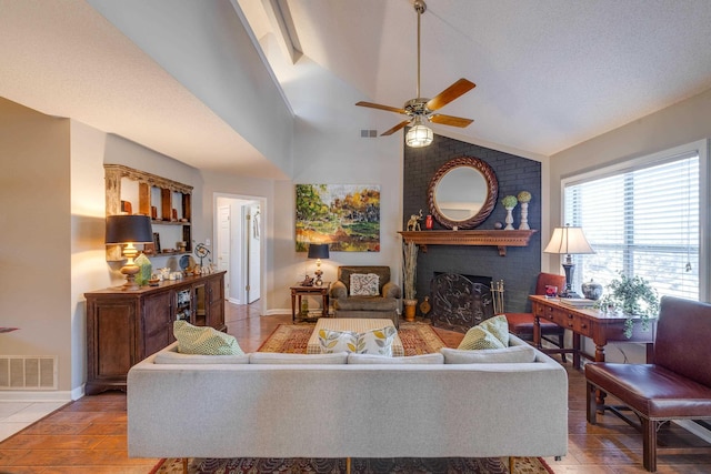 living area with visible vents, baseboards, a brick fireplace, and ceiling fan