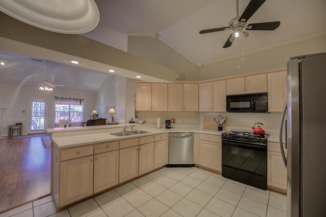 kitchen featuring a sink, black appliances, light countertops, crown molding, and open floor plan