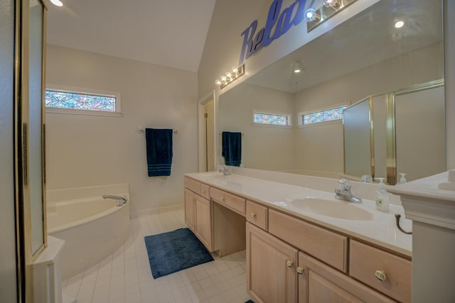 bathroom featuring double vanity, a bath, a healthy amount of sunlight, and a sink