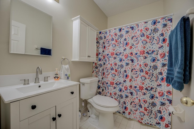 bathroom with vanity, tile patterned floors, curtained shower, and toilet