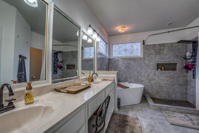 bathroom featuring double vanity, a soaking tub, tiled shower, and a sink