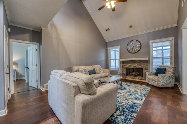 living area featuring a wealth of natural light, dark wood finished floors, and crown molding