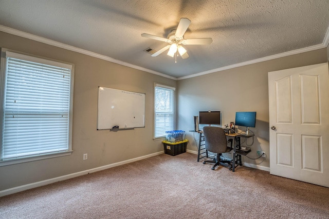 home office with a ceiling fan, visible vents, carpet floors, and ornamental molding