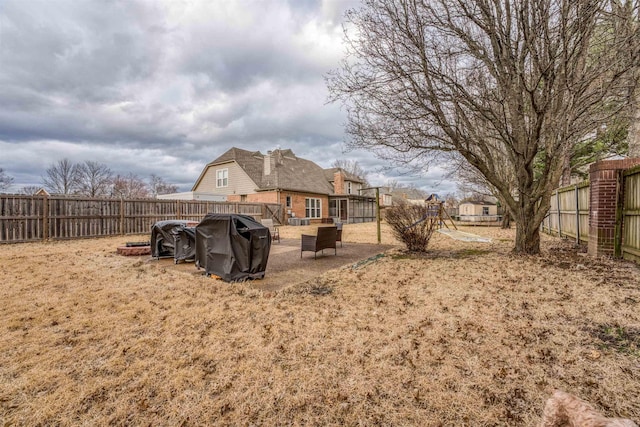 view of yard with a fenced backyard