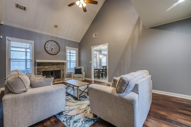 living area with crown molding, wood finished floors, and visible vents