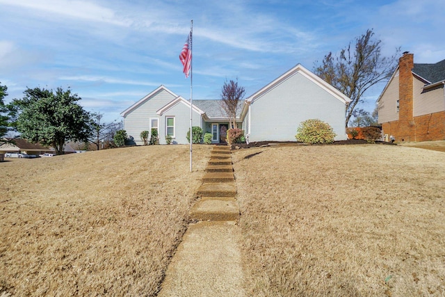 single story home with a front yard