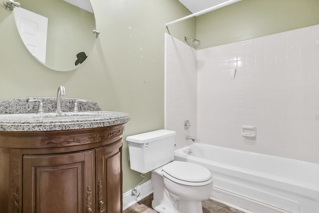 bathroom featuring vanity, toilet, shower / bath combination, and baseboards