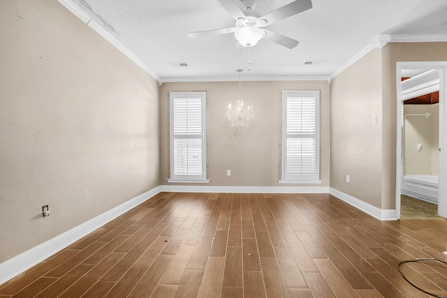 spare room with plenty of natural light, dark wood finished floors, and crown molding