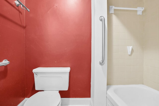 full bathroom with toilet and baseboards