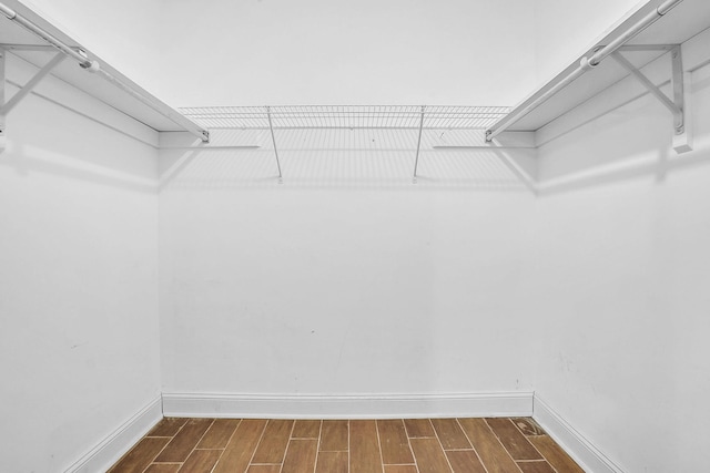 spacious closet featuring wood tiled floor