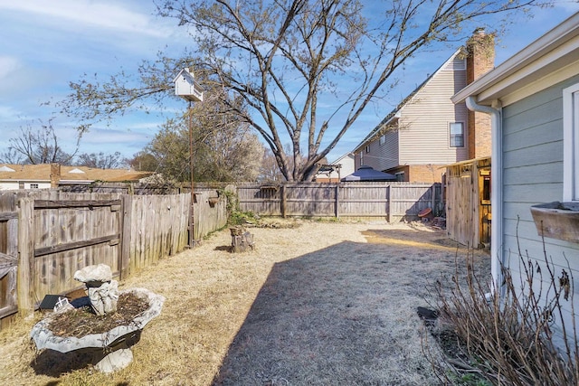 view of yard with a fenced backyard