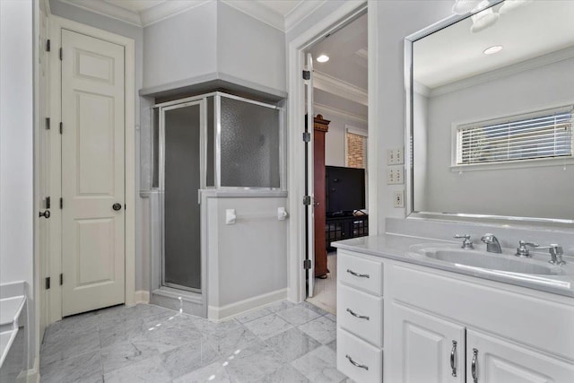 full bathroom featuring vanity, ornamental molding, and a shower stall