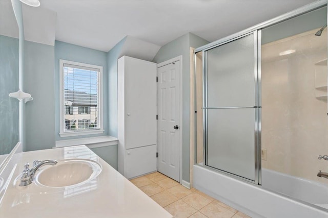 full bath featuring tile patterned flooring, vanity, and shower / bath combination with glass door