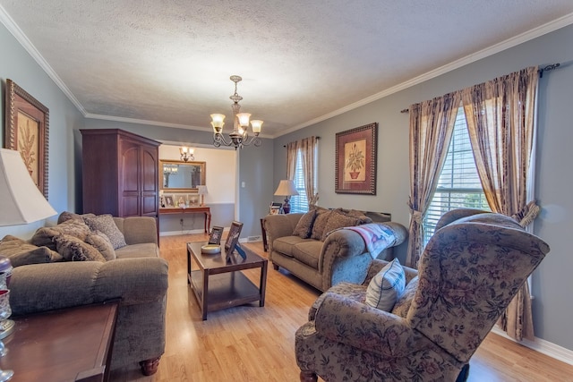 living room featuring light wood-style flooring, baseboards, a textured ceiling, and a chandelier