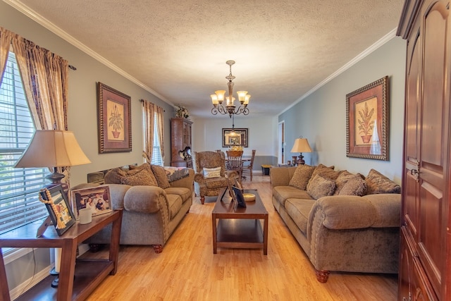 living area featuring a notable chandelier, light wood-type flooring, and a wealth of natural light