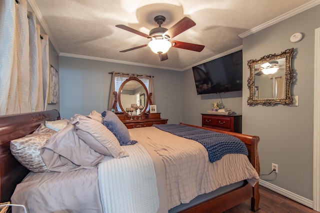 bedroom featuring wood finished floors, baseboards, ceiling fan, a textured ceiling, and crown molding