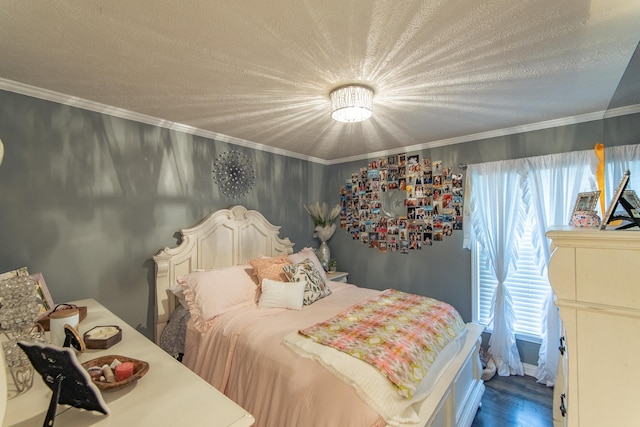 bedroom featuring a textured ceiling, crown molding, and wood finished floors