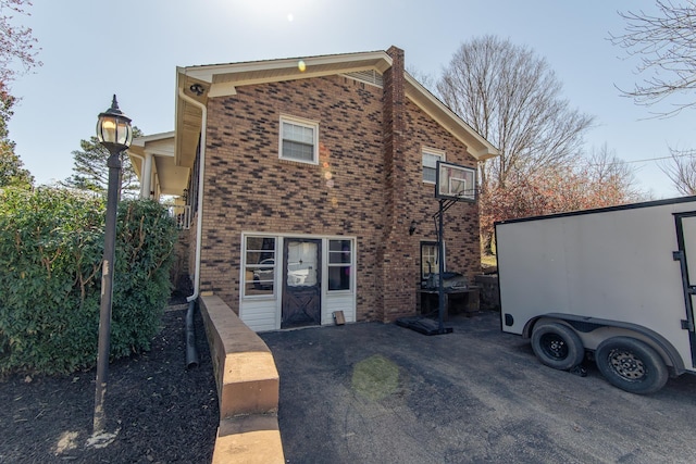 view of front of home featuring brick siding