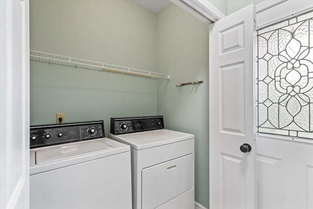 laundry area with washer and clothes dryer and laundry area