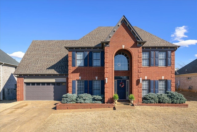 view of front facade with an attached garage and brick siding