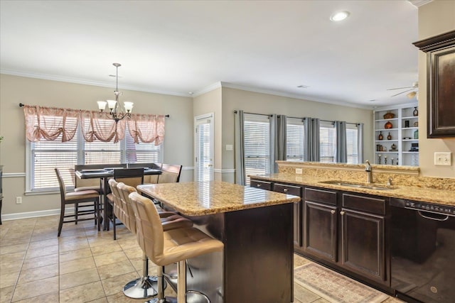 kitchen featuring dark brown cabinets, dishwasher, and a healthy amount of sunlight