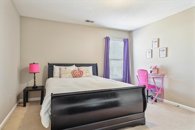 bedroom with visible vents, baseboards, carpet, and a textured ceiling