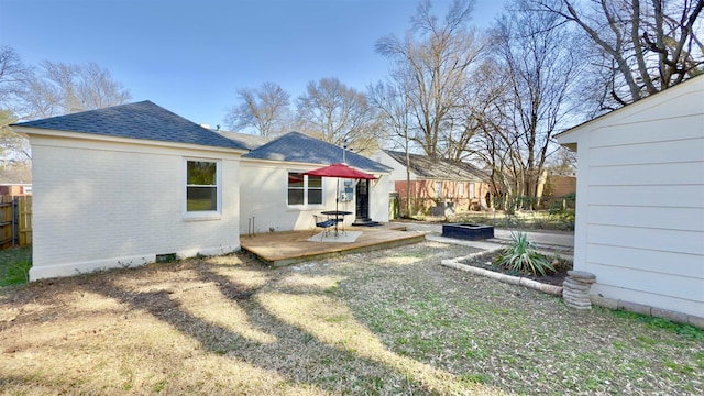 view of yard with a wooden deck and fence