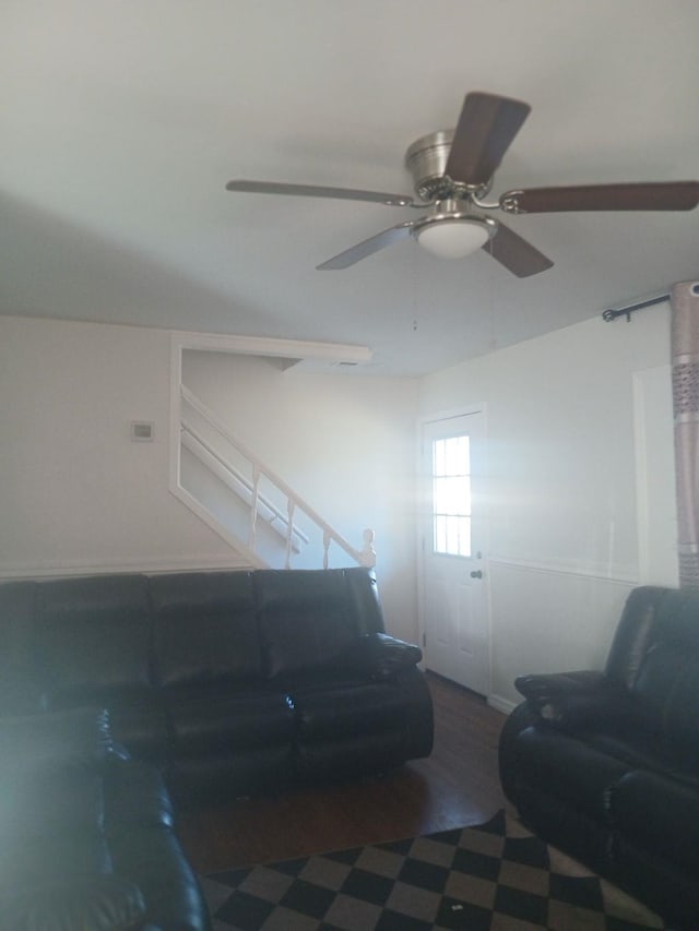 living area with a ceiling fan